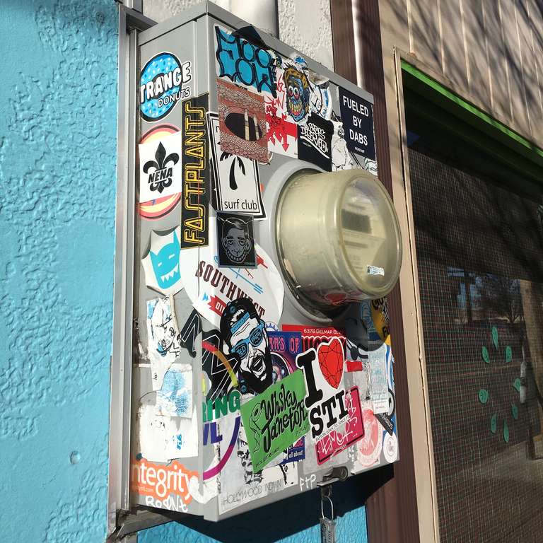 An electrical meter covered in stickers