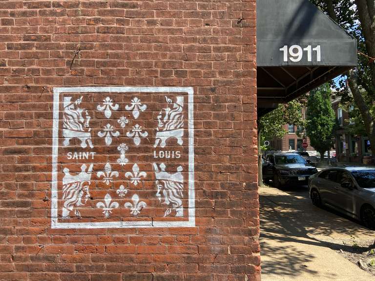 a spray painted mural on a brick wall
